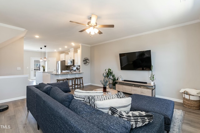 living room featuring baseboards and wood finished floors