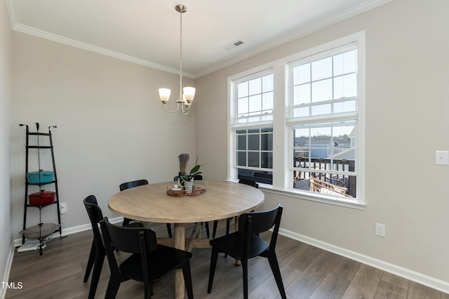 dining area with visible vents, baseboards, dark wood-style floors, and crown molding