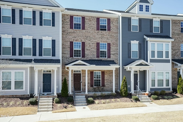 view of property featuring brick siding