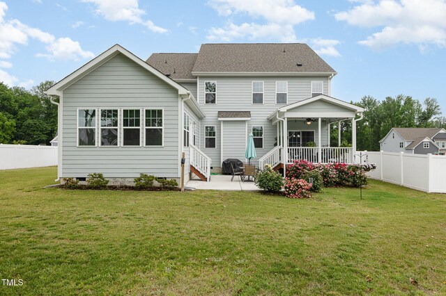 rear view of house with crawl space, a fenced backyard, a ceiling fan, and a patio area