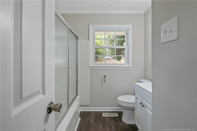 bathroom featuring visible vents, baseboards, toilet, ornamental molding, and wood finished floors