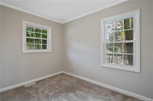 unfurnished room with visible vents, carpet floors, baseboards, and a healthy amount of sunlight