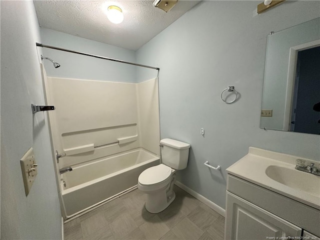 bathroom featuring baseboards, toilet, vanity, shower / bathing tub combination, and a textured ceiling