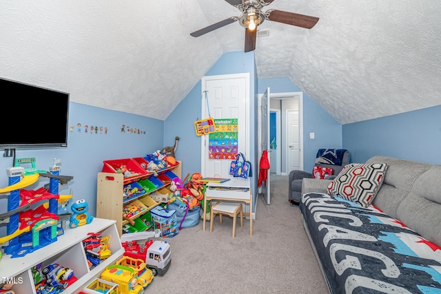 game room with visible vents, carpet floors, ceiling fan, vaulted ceiling, and a textured ceiling