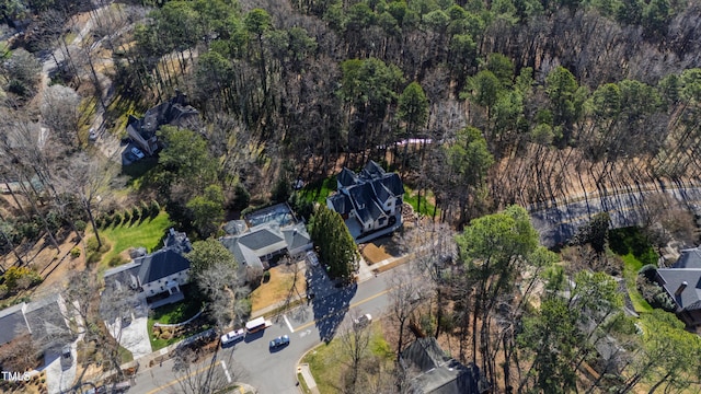 bird's eye view featuring a wooded view