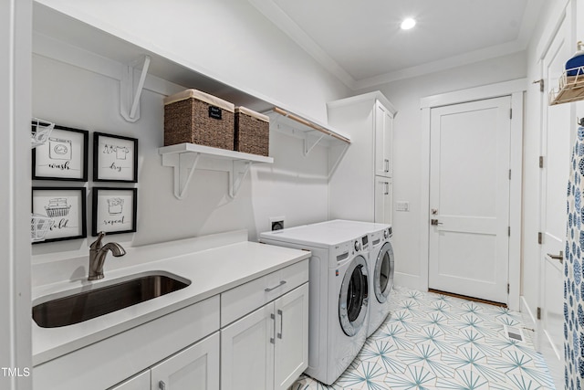 laundry room featuring recessed lighting, cabinet space, ornamental molding, a sink, and independent washer and dryer