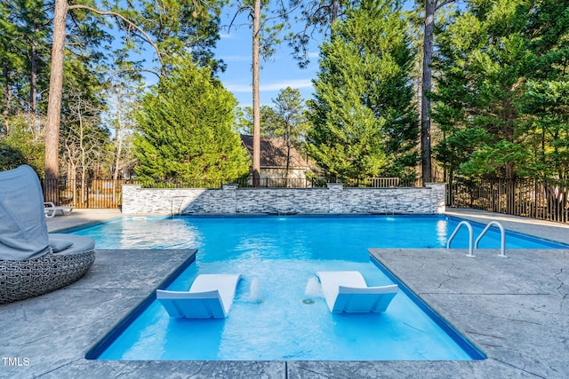 view of pool with fence and a fenced in pool