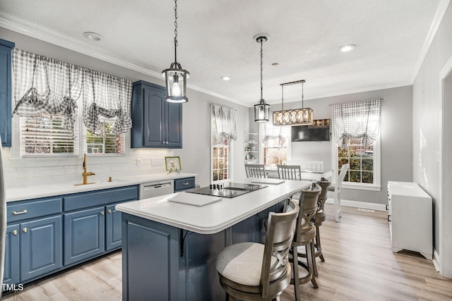 kitchen with blue cabinets, black electric cooktop, decorative backsplash, and light countertops