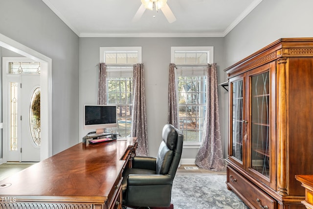 office featuring visible vents, a ceiling fan, and crown molding