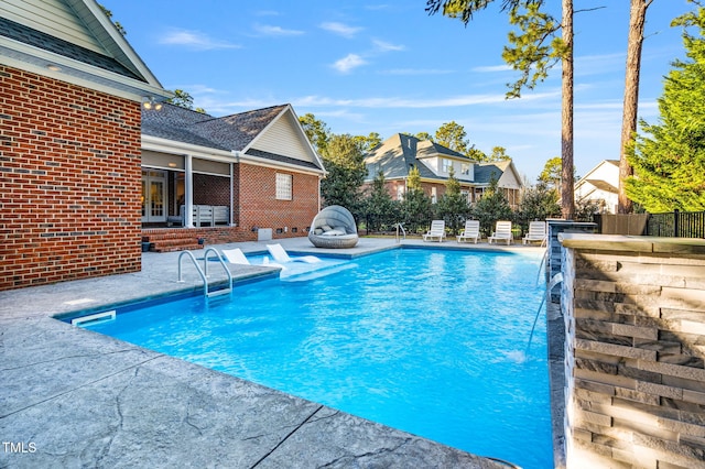 view of pool with a fenced in pool, a patio, and a fenced backyard