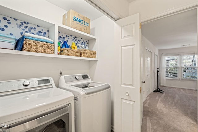 washroom featuring laundry area, carpet flooring, and washing machine and clothes dryer