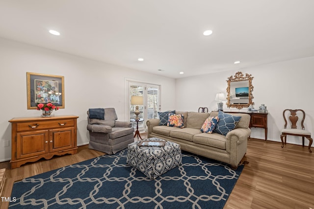 living area featuring recessed lighting and light wood finished floors