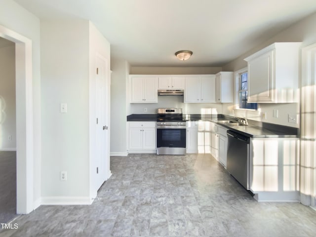 1125 Field Meadows Dr, Zebulon, NC 27597 - kitchen with under cabinet range hood, white cabinets, stainless steel appliances, and a sink