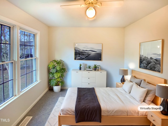 1125 Field Meadows Dr, Zebulon, NC 27597 - carpeted bedroom with a ceiling fan and baseboards