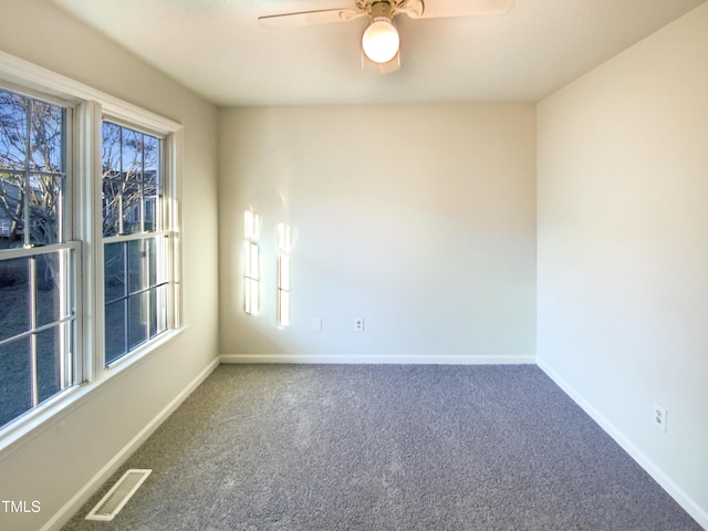 1125 Field Meadows Dr, Zebulon, NC 27597 - carpeted spare room with visible vents, baseboards, a healthy amount of sunlight, and ceiling fan