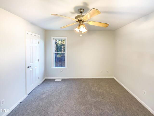 1125 Field Meadows Dr, Zebulon, NC 27597 - empty room with baseboards, dark colored carpet, and ceiling fan