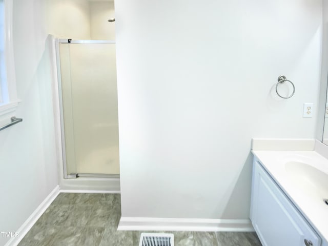 1125 Field Meadows Dr, Zebulon, NC 27597 - full bath with vanity, baseboards, visible vents, and a stall shower