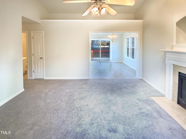 1125 Field Meadows Dr, Zebulon, NC 27597 - unfurnished living room with carpet flooring, baseboards, a fireplace, and vaulted ceiling