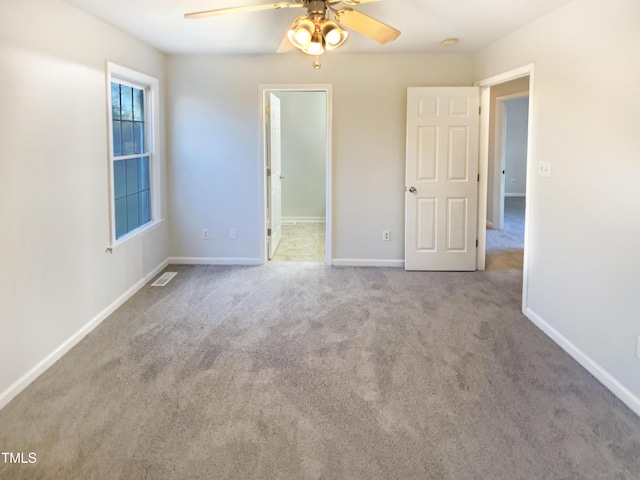 1125 Field Meadows Dr, Zebulon, NC 27597 - unfurnished bedroom featuring baseboards, carpet floors, visible vents, and a ceiling fan
