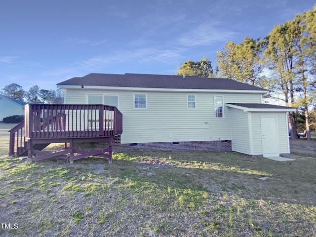 1125 Field Meadows Dr, Zebulon, NC 27597 - back of property with a storage unit, a lawn, a deck, an outdoor structure, and crawl space