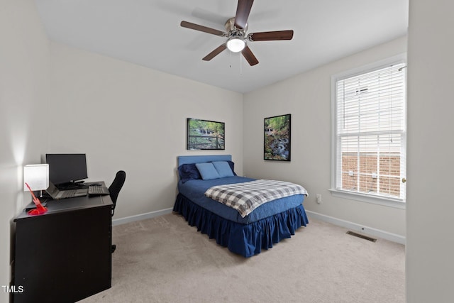 bedroom with visible vents, ceiling fan, baseboards, and carpet