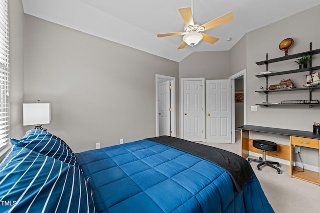 bedroom with carpet flooring, a ceiling fan, and lofted ceiling