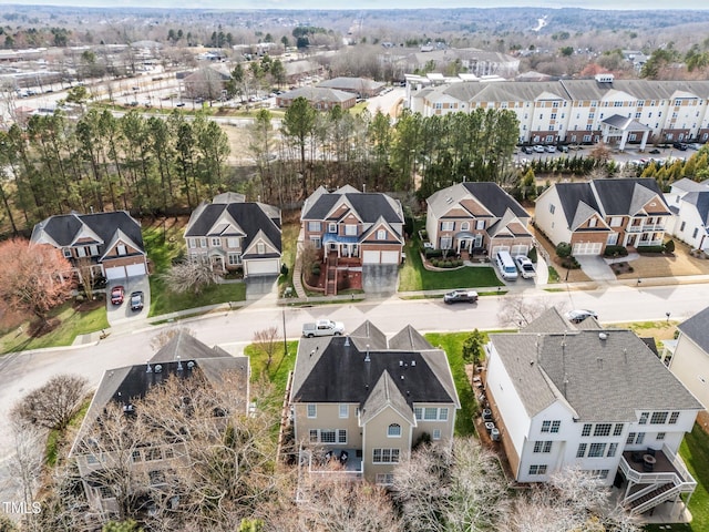 birds eye view of property with a residential view