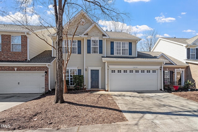 view of front facade featuring brick siding, an attached garage, concrete driveway, and a shingled roof