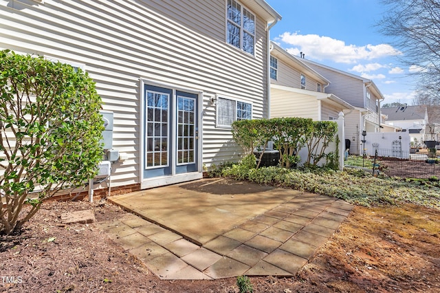 exterior space with a patio and fence