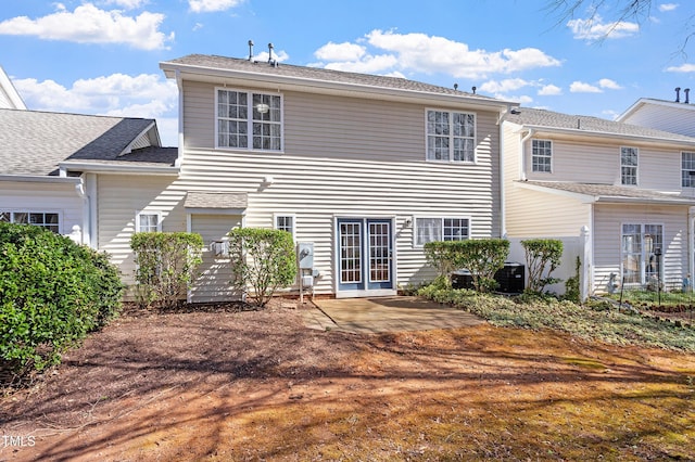 back of property featuring cooling unit and a patio area