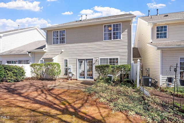 rear view of property featuring central air condition unit, a patio, and fence