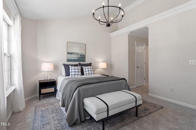 bedroom with a notable chandelier, baseboards, and carpet floors