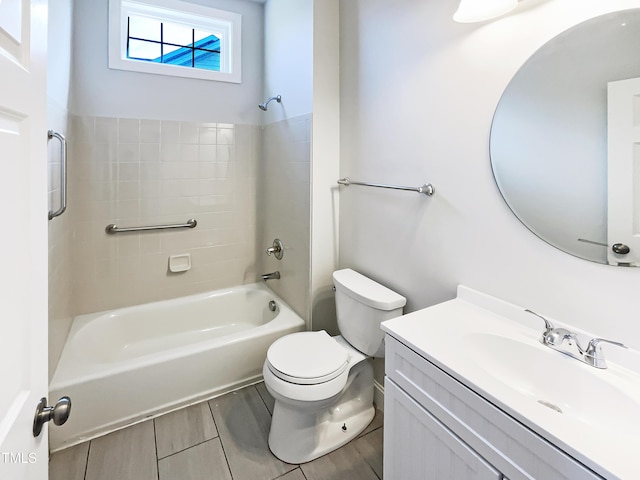 bathroom with vanity, toilet, and bathtub / shower combination