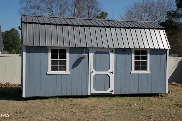 view of shed with fence