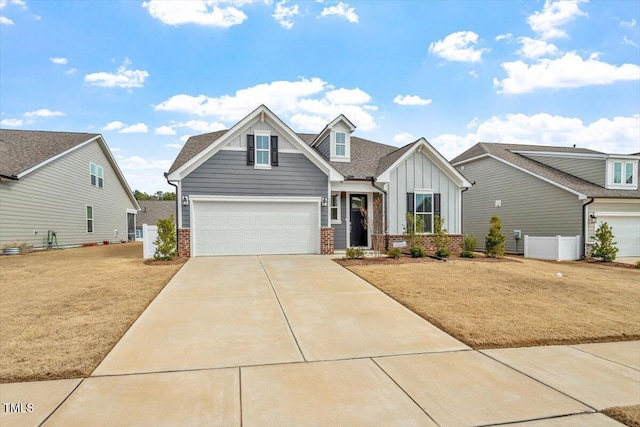 view of front of property with brick siding, board and batten siding, concrete driveway, and a garage