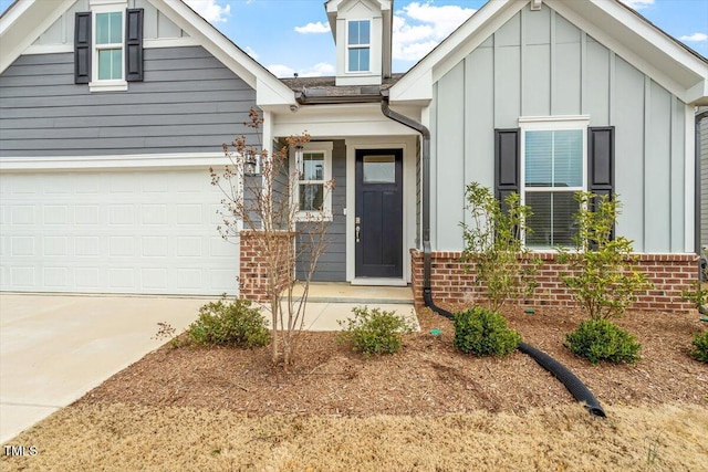 view of front facade featuring a garage, brick siding, board and batten siding, and concrete driveway