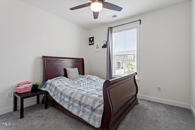 bedroom featuring a ceiling fan, baseboards, visible vents, and carpet floors