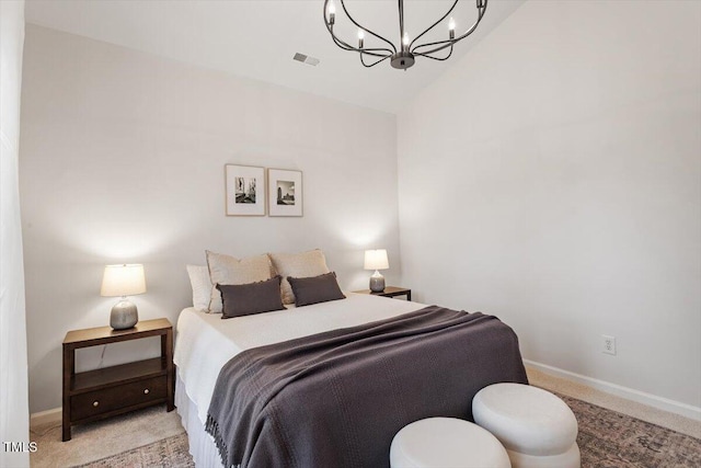 bedroom featuring visible vents, light carpet, a notable chandelier, and baseboards