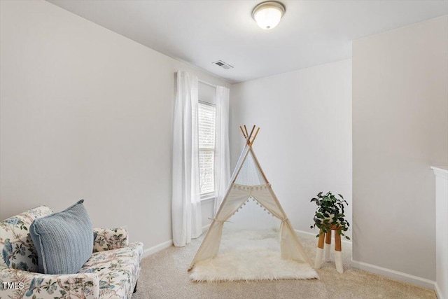 playroom with visible vents, baseboards, and carpet