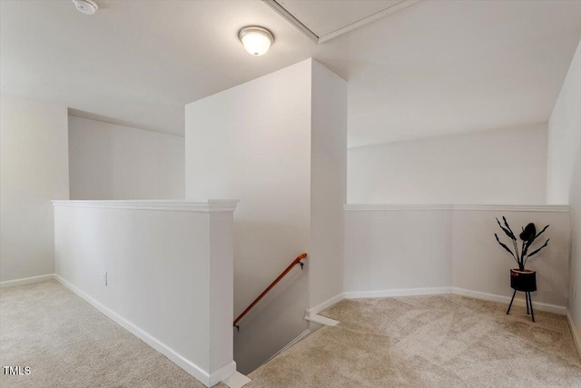 interior space featuring baseboards and carpet floors