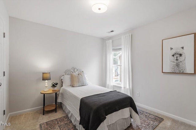 bedroom featuring carpet, visible vents, and baseboards