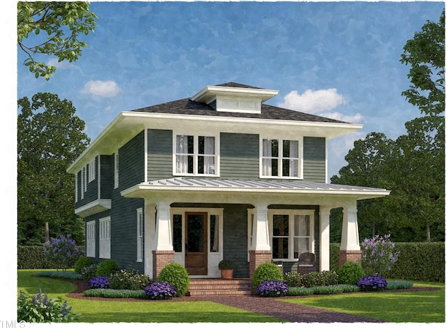 american foursquare style home with a front yard, a standing seam roof, covered porch, brick siding, and metal roof