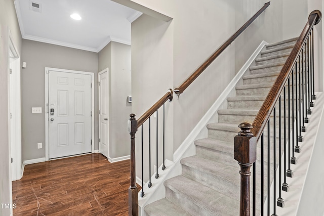 foyer featuring visible vents, recessed lighting, crown molding, baseboards, and dark wood-style flooring