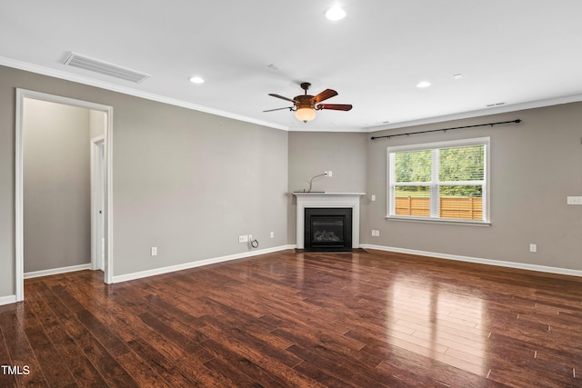 unfurnished living room featuring crown molding, a fireplace with flush hearth, wood finished floors, and visible vents