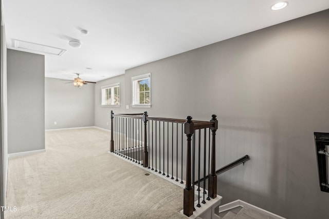 stairs featuring attic access, baseboards, and carpet