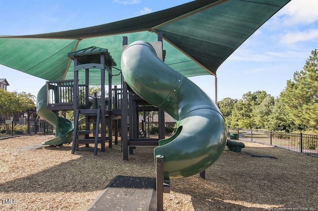 communal playground featuring fence