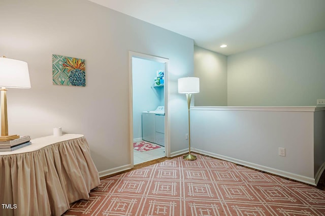 unfurnished bedroom featuring recessed lighting, washing machine and dryer, connected bathroom, and baseboards