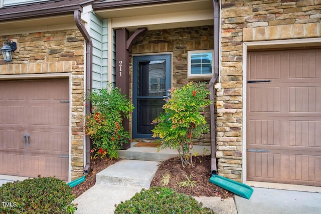 doorway to property featuring stone siding