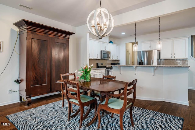 dining room featuring visible vents, baseboards, recessed lighting, dark wood-type flooring, and a notable chandelier