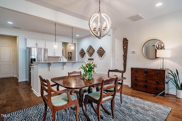 dining room featuring recessed lighting, dark wood-style floors, and visible vents